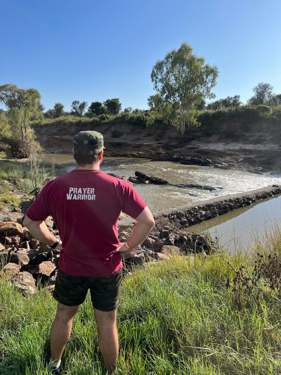 Brothers sharing a meal together around the camp table